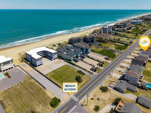 an aerial view of a beach near the ocean at 5070 - Sandy Bottoms in Kill Devil Hills