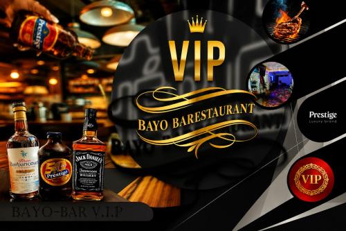 a poster for a bar with two bottles of whisky at BAYO-HOTEl in Vaudreuil