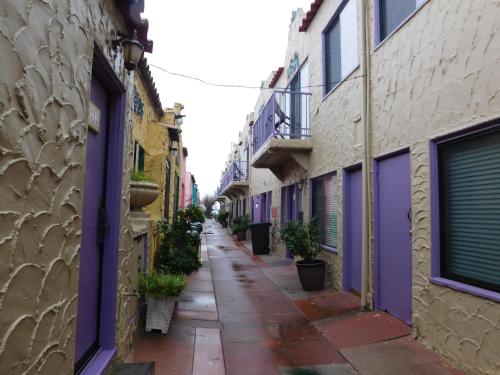an alley in an old town with colorful buildings at Capitola Venetian Vacation Rentals in Capitola
