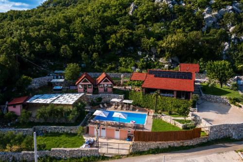 an aerial view of a house in a mountain at Peuta Hill in Podgorica