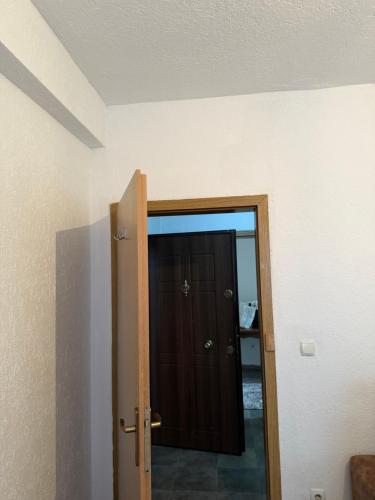 a door that is open to a room at Ring Urban Apartment in Kosovo Polje