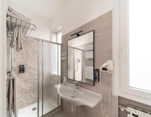 a bathroom with a sink and a shower at Hotel University in Bologna