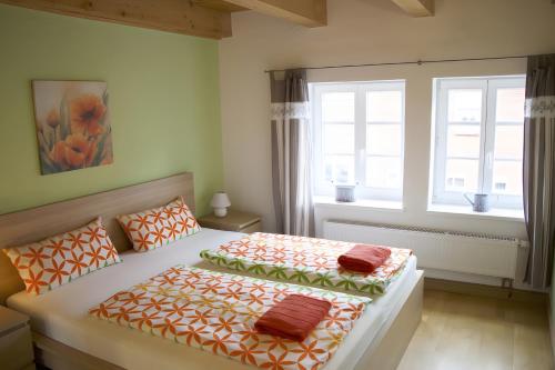 a bedroom with a bed with two pillows on it at Kleines Meer in Röbel