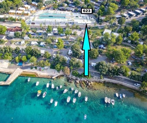 an aerial view of a marina with boats in the water at SEA HOUSE pool & jacuzzi - PRIVILEGE POINT camping & villas in Selce