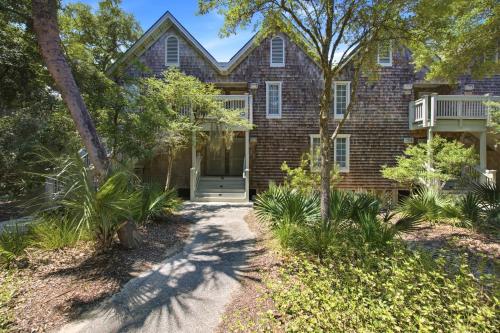 a brick house with a walkway in front of it at Seascape 3522 in Kiawah Island