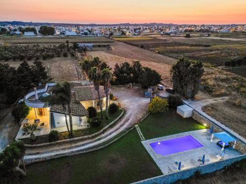 an aerial view of a house with a swimming pool at Villa Cassandra in Alliste
