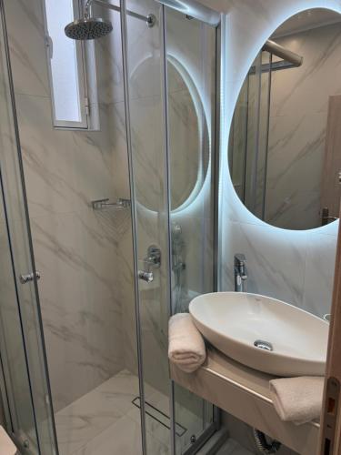 a bathroom with a sink and a shower at Marinas view apartment in Limenas