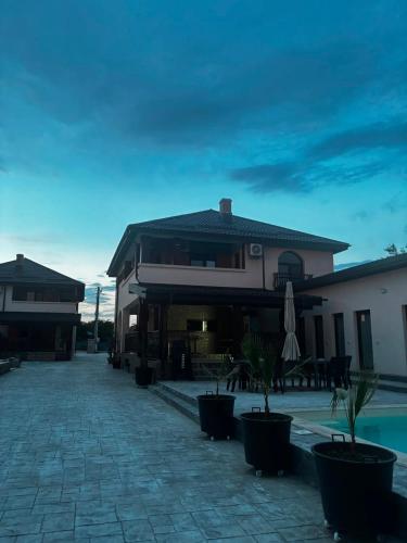 a house with a patio and a pool at Complexul Profestur in Valea Dragului
