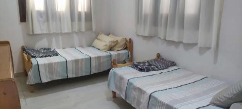 a room with two beds in a room at Zaytouna camp Room 2 in Marsa Matruh