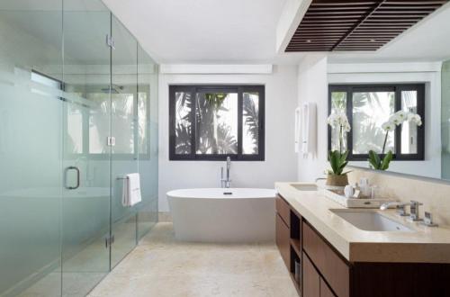 a bathroom with a tub and a sink and a shower at Porta Fortuna Villa Punta Mita Gates in Punta Mita