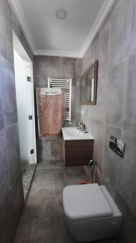 a bathroom with a toilet and a sink at Fantastic appartement in Hammam Sousse
