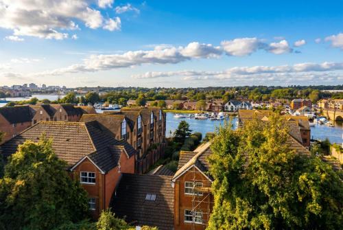 a view of a town with a river and houses at The Bitterne Park Hotel in Southampton
