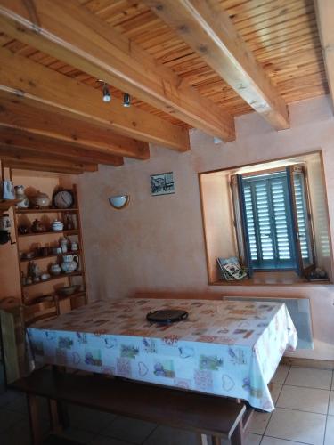 a room with a table and a window at gite du coin in Cunlhat