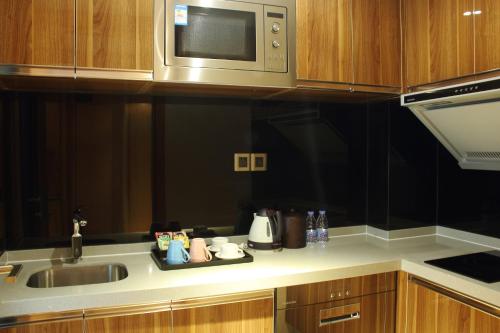 Una cocina o zona de cocina en Sentosa Hotel Apartment Taoyuan Branch