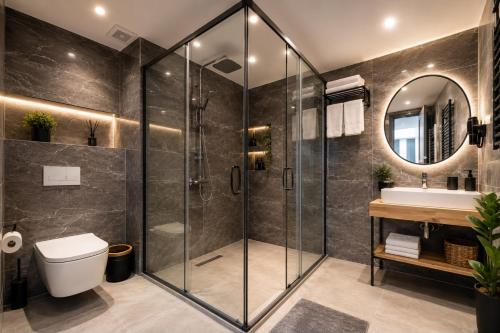 a bathroom with a shower and a toilet and a sink at Art Karakoy Hotel in Istanbul