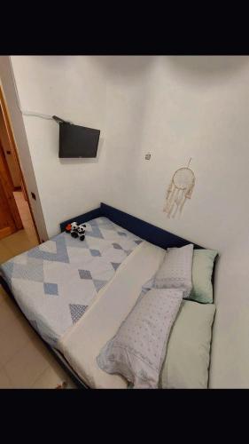 a small bed in a room with a bed frame at Da Ross in Castel di Sangro