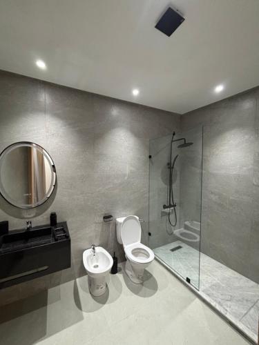 a bathroom with a toilet and a sink and a shower at villa HLH in Tangier