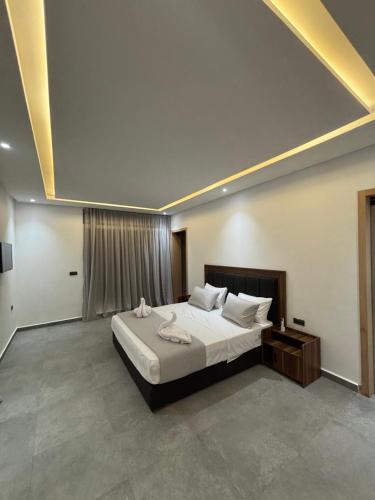 a bedroom with a large bed in a room at villa HLH in Tangier