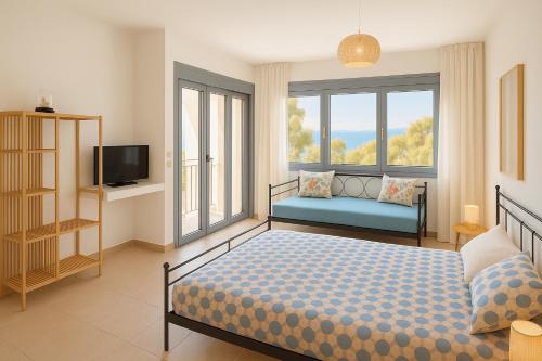 a bedroom with a bed and a tv and windows at Antigone Salty Studio in Vathí