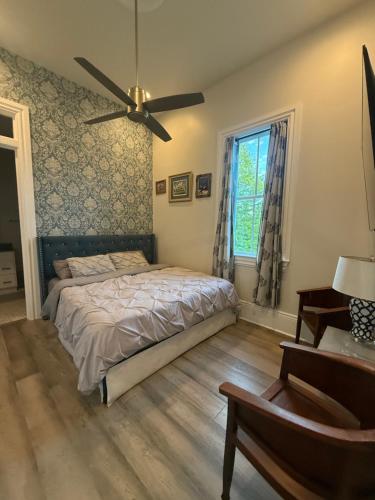 a bedroom with a bed and a ceiling fan at Blue Crawfish Boutique Hotel & Pool Bar in New Orleans