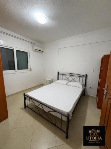 a bedroom with a bed in a room at Utopia Apartment in Kallithea Halkidikis