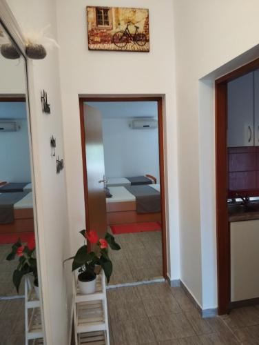 a room with a view of a bedroom at Apartmani Zara & Duje in Bibinje