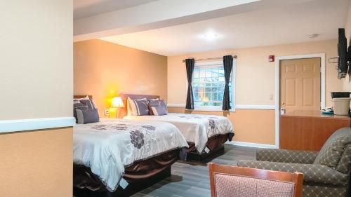 En eller flere senge i et værelse på Briarcliff Motel