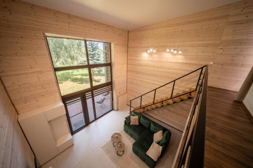 a room with a bunk bed and a large window at Rusnės Vėjas in Rusnė