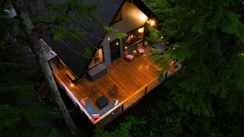 an overhead view of a house with a deck at night at Hidden Fern Cabin in Glacier