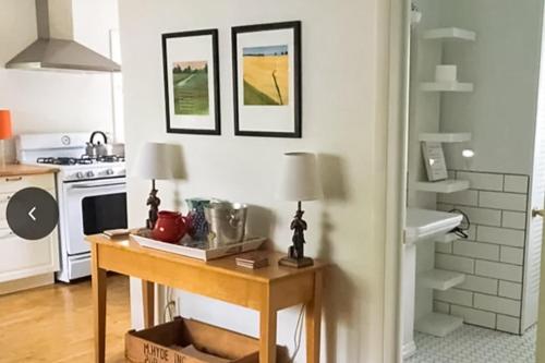 a kitchen with a table and a stove at Steps to Beach & Lake Michigan! Family Retreat in Turner Shores