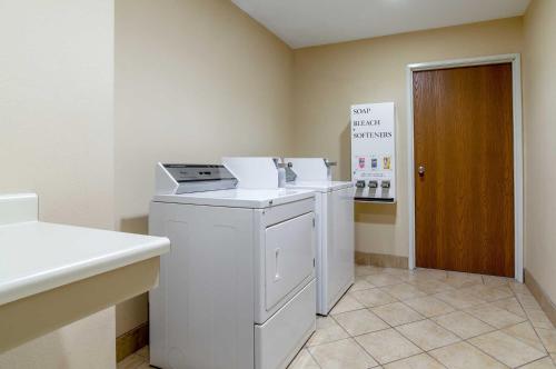 a laundry room with a washer and dryer at Super 8 by Wyndham Great Bend in Great Bend