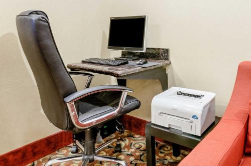 an office with a desk with a computer and a printer at Super 8 by Wyndham Great Bend in Great Bend