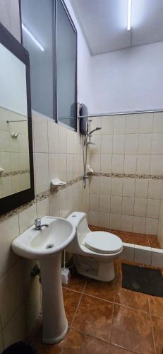 a bathroom with a toilet and a sink at Lima Centro Apartment 3 in Lima