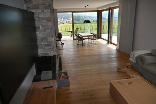 a living room with a couch and a fireplace at Haus Preber in Mariapfarr