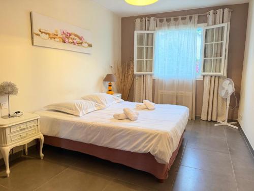 a bedroom with a bed and a window at "U Monte Rossu" – T2 paisible | by Efficios in Petreto-Bicchisano