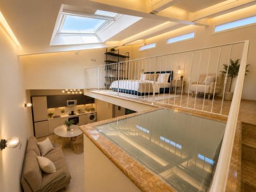 a large room with a bed and a living room at Galeo Suites in Florence