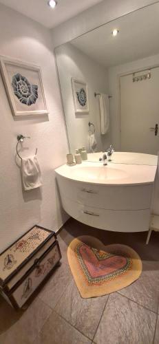 a bathroom with a white sink and a mirror at Casa Fery in Contra
