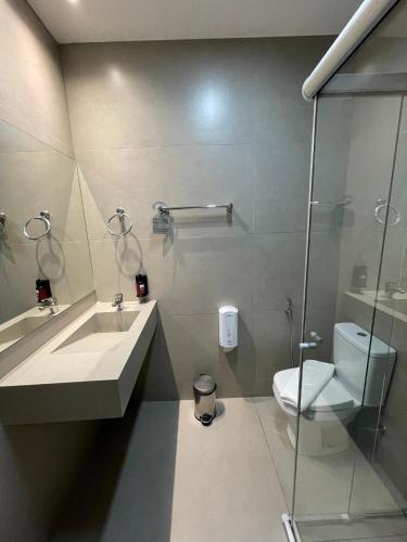 a bathroom with a sink and a toilet at Serra Palace Hotel in Ouro Branco