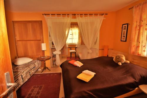a bedroom with a bed with a teddy bear on it at Ferienhaus Rieger in Mallnitz