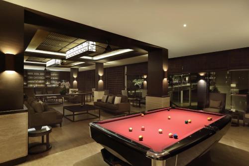 a billiard room with a pool table in it at Grand Luley Manado in Manado