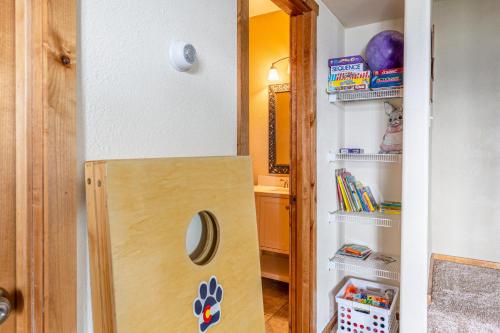 a door to a refrigerator in a room at Breathtaking Mtn & Lake Views! Glacier Country Gem in Dayton