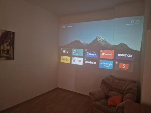 a room with a large screen on a wall at Apartment nad Sveikem in Karlovy Vary