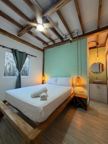 a bedroom with a large bed in a room at Hotel Stay Mar Baru in Cartagena de Indias