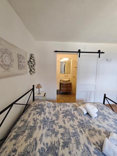 a bedroom with a bed with two pillows on it at DAMMUSI IL CARRUBO in Pantelleria