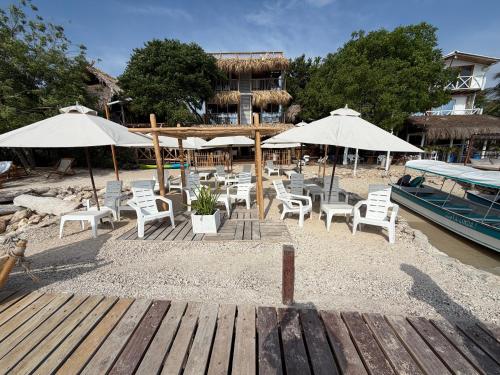 a group of chairs and umbrellas on a beach at Hotel Stay Mar Baru in Cartagena de Indias
