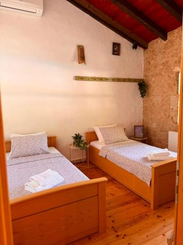a bedroom with two beds in a room at Etno vila Međugorje in Čapljina