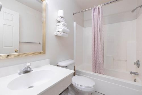 a white bathroom with a sink and a toilet at Marianna Inn Panguitch in Panguitch