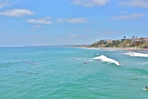 a group of people in the water at a beach at San Clemente - Villa Del Mar in San Clemente