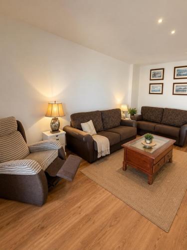 a living room with a couch and a coffee table at Amazing view bungalow MA2 in Torrevieja