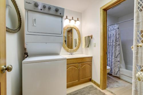 a bathroom with a sink and a washer and dryer at 'Marble Hideaway' Cabin w/ Mountain Views + Deck! in Marble